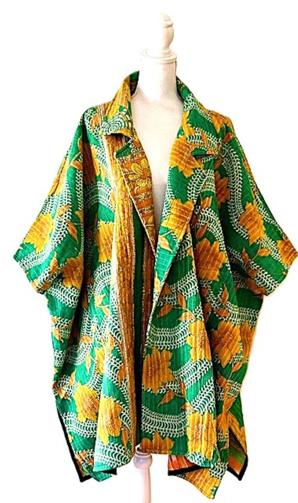 Fully Reversible Blanket Coat Is Bold In Green and Orange.