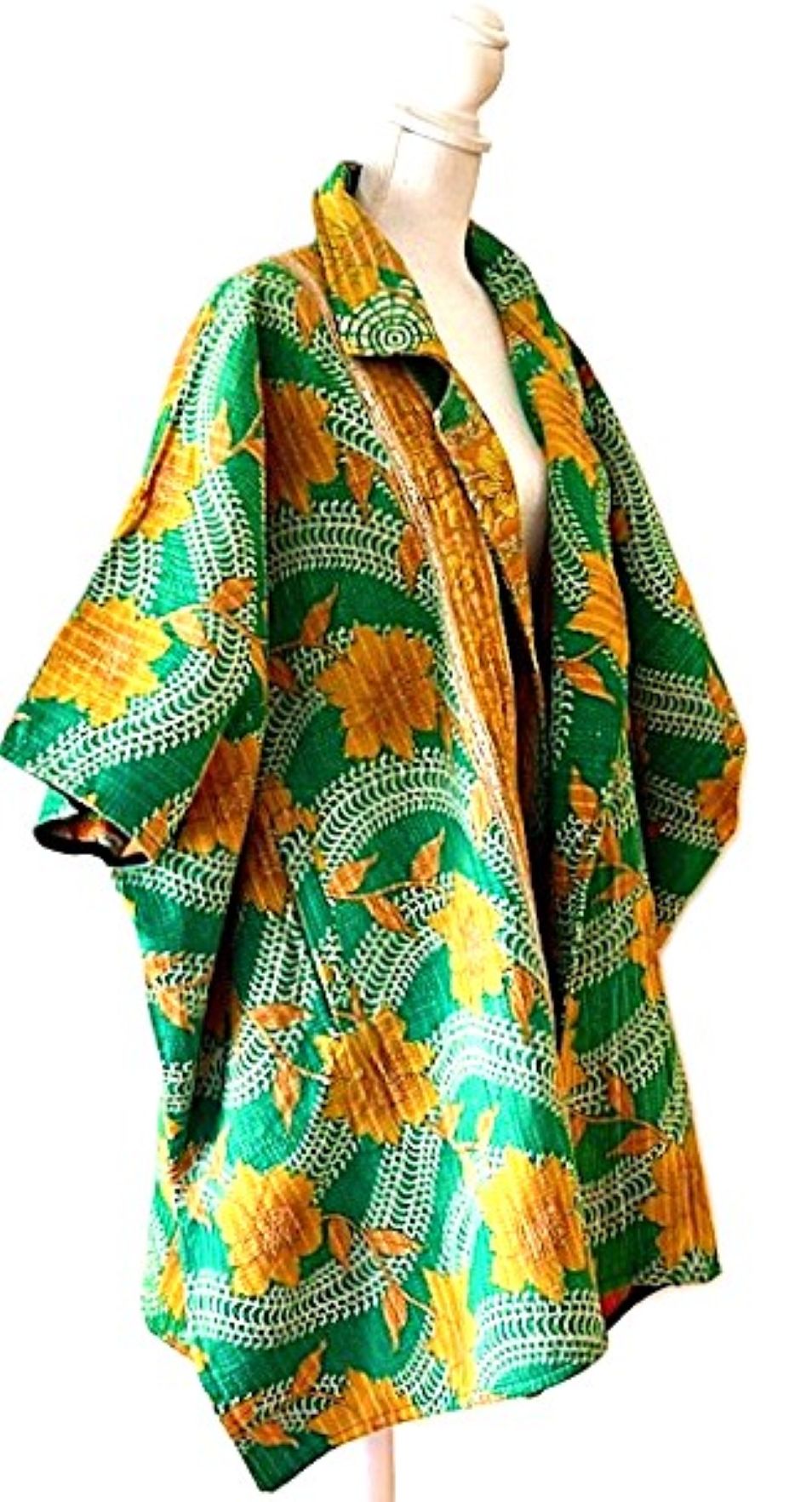 Fully Reversible Blanket Coat Is Bold In Green and Orange.