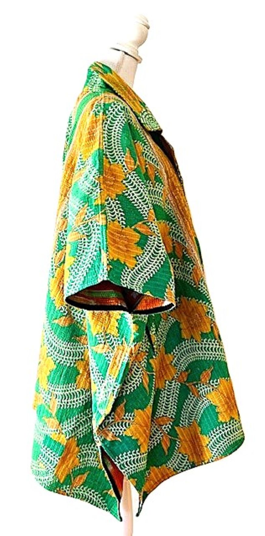 Fully Reversible Blanket Coat Is Bold In Green and Orange.